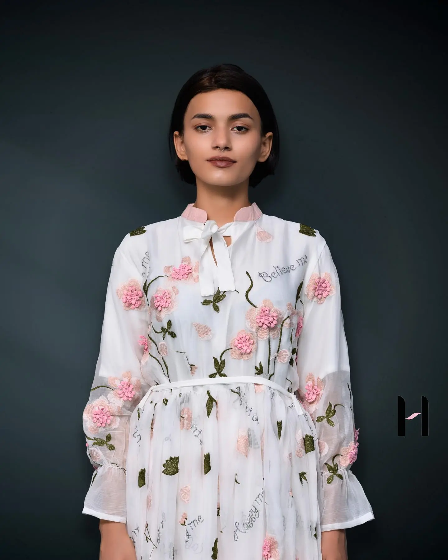 White Floral Chiffon Dress Set White Floral Chiffon Dress Set – A flowy white dress with a delicate pop-up flower design, paired with fitted trousers for a stylish and comfortable look.